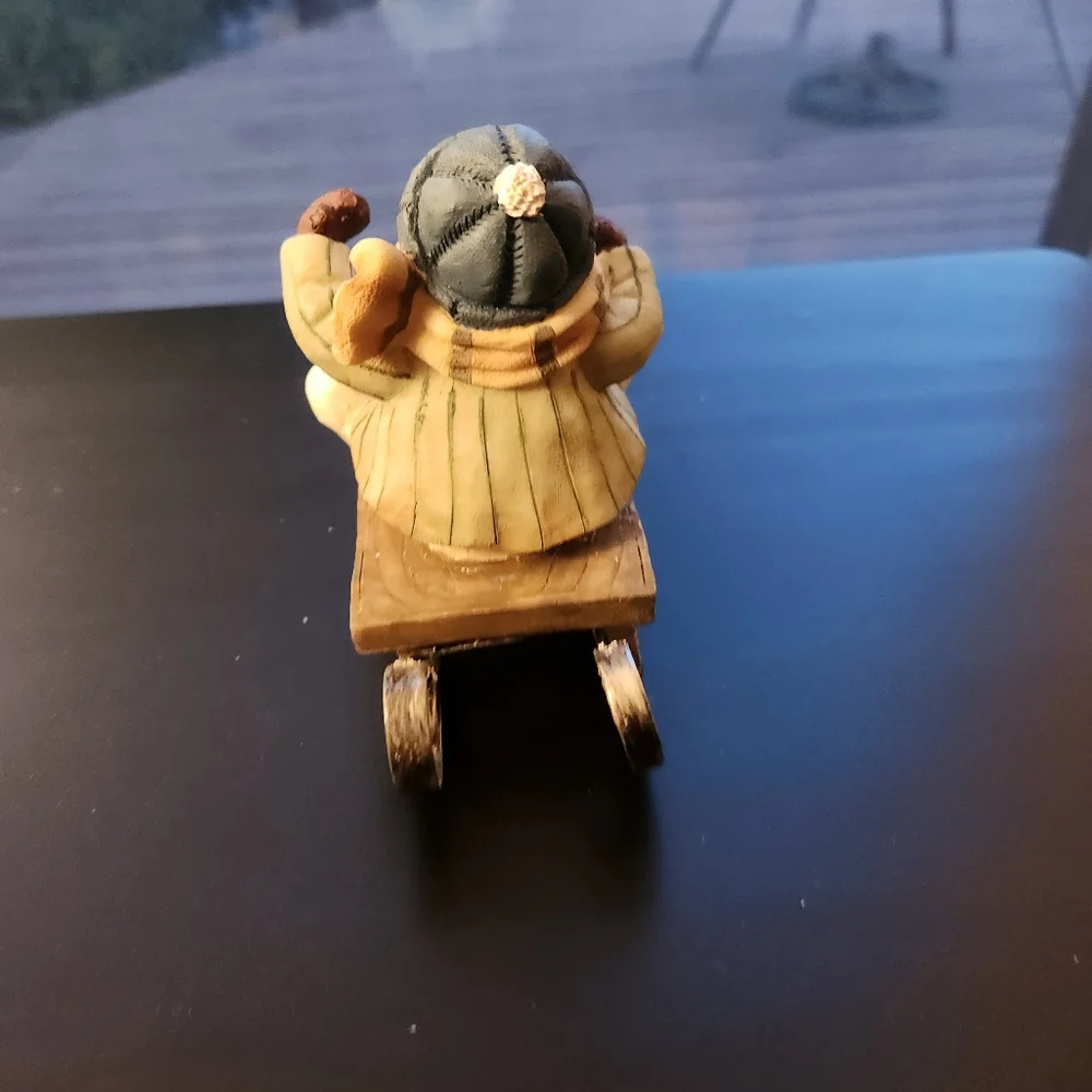 Sledding Snowman Figurine